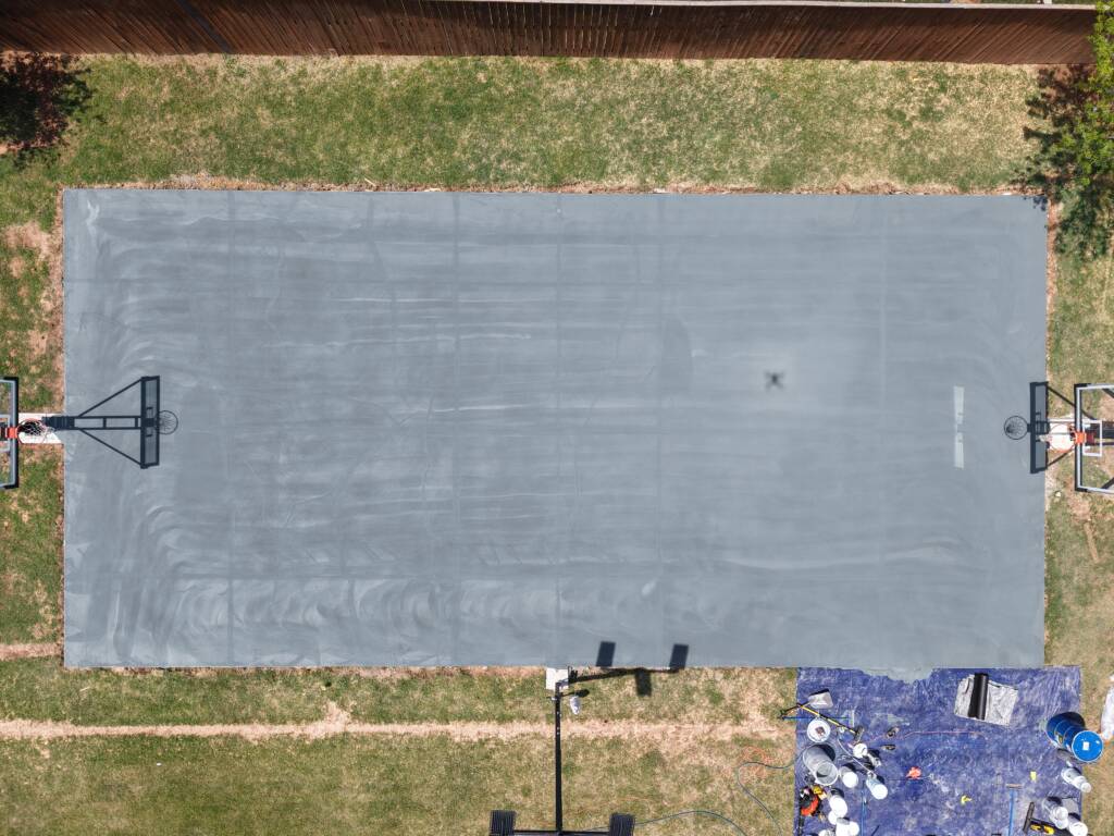 Backyard pickleball court with SnapSports surface and LED lighting in Lubbock, TX