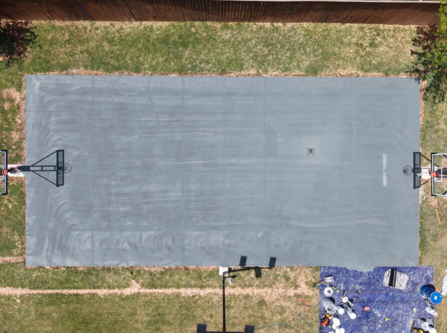 Backyard pickleball court with SnapSports surface and LED lighting in Lubbock, TX