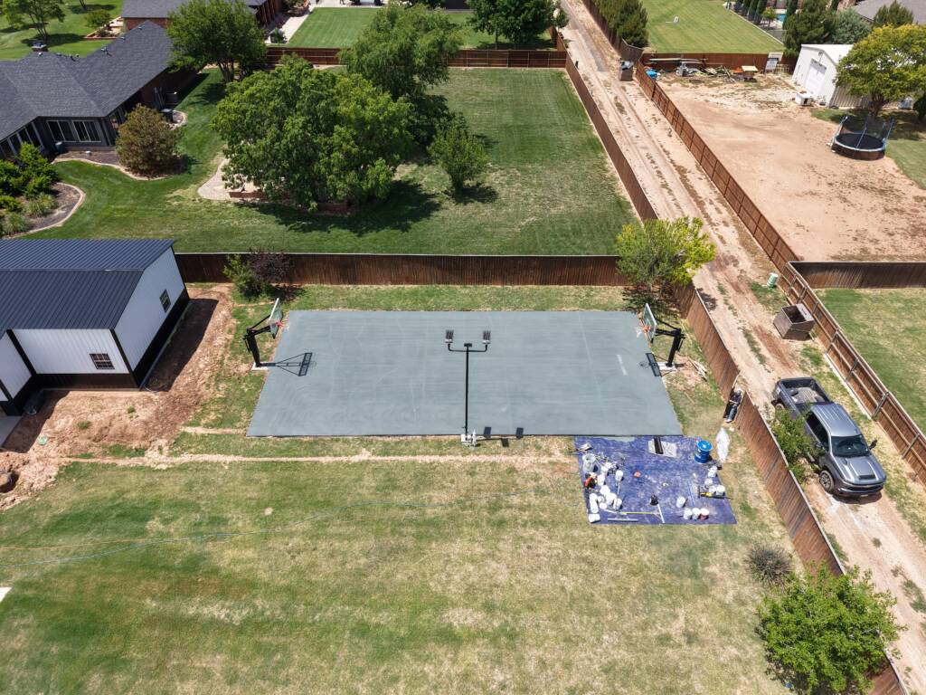 Backyard pickleball court with acrylic hard court surface and LED lighting in Lubbock, TX