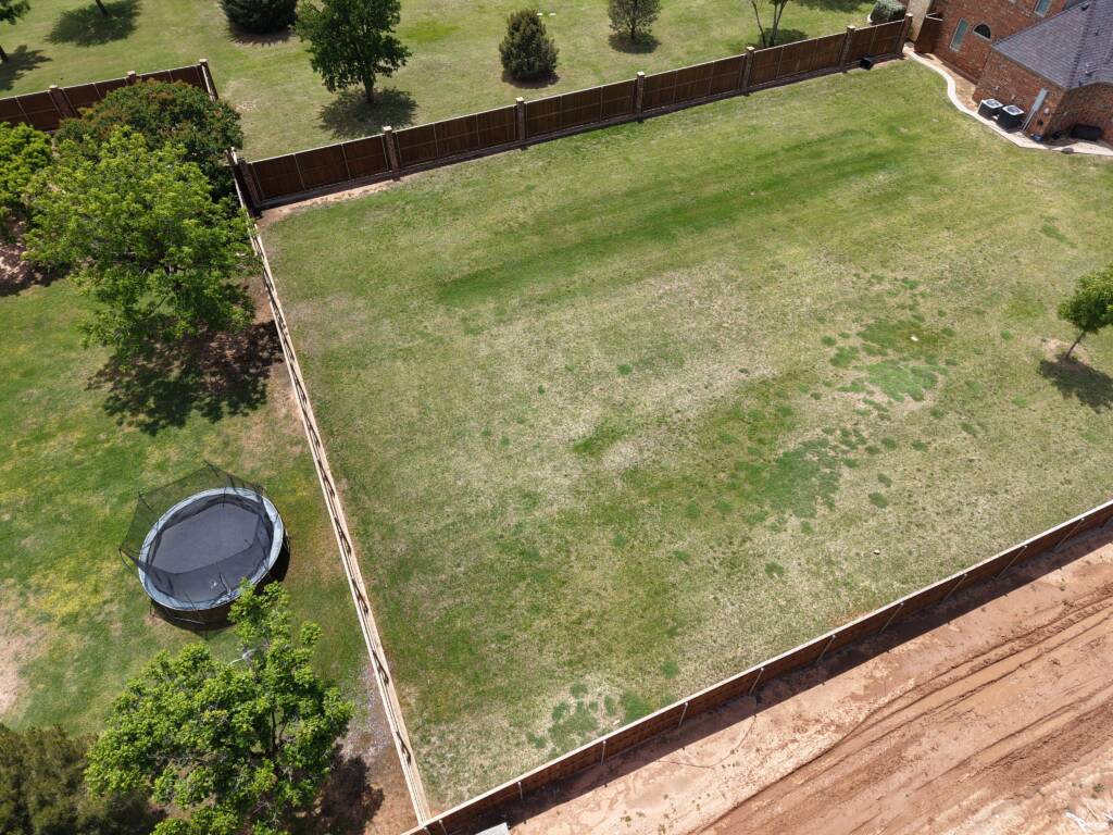 Backyard pickleball court with SnapSports surface and LED lighting in Lubbock, TX