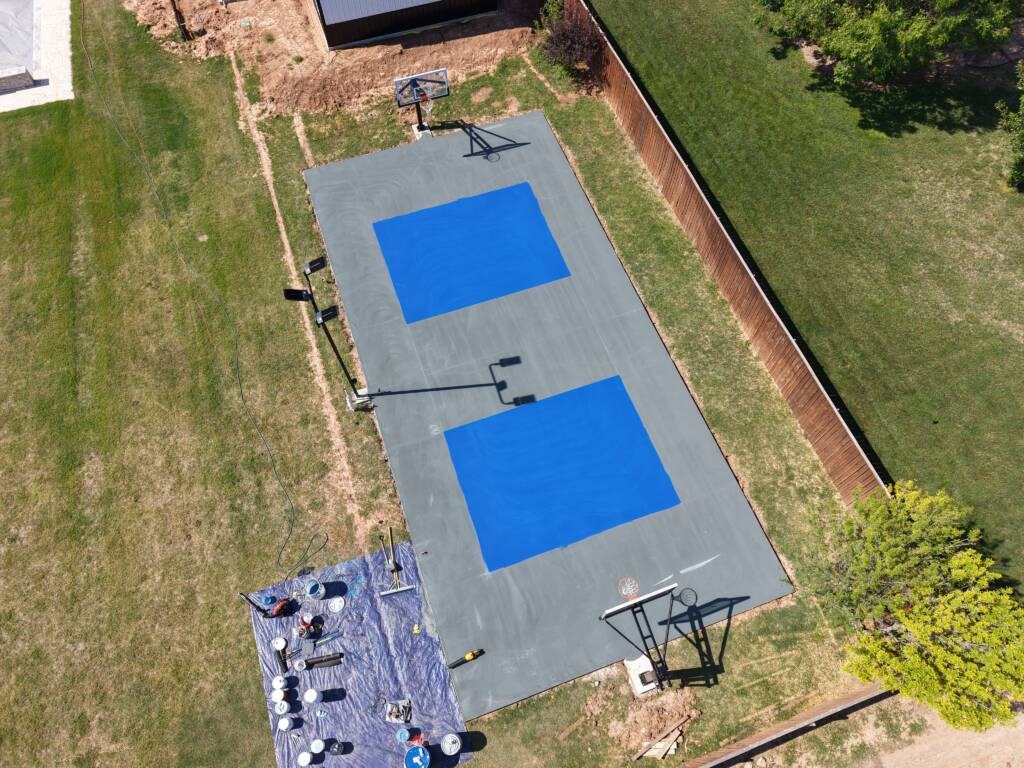 Backyard pickleball court with SnapSports surface and LED lighting in Lubbock, TX
