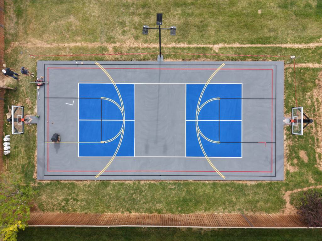 Backyard pickleball court with acrylic hard court surface and LED lighting in Lubbock, TX