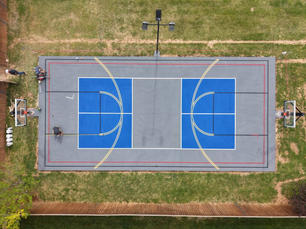Backyard pickleball court with SnapSports surface and LED lighting in Lubbock, TX