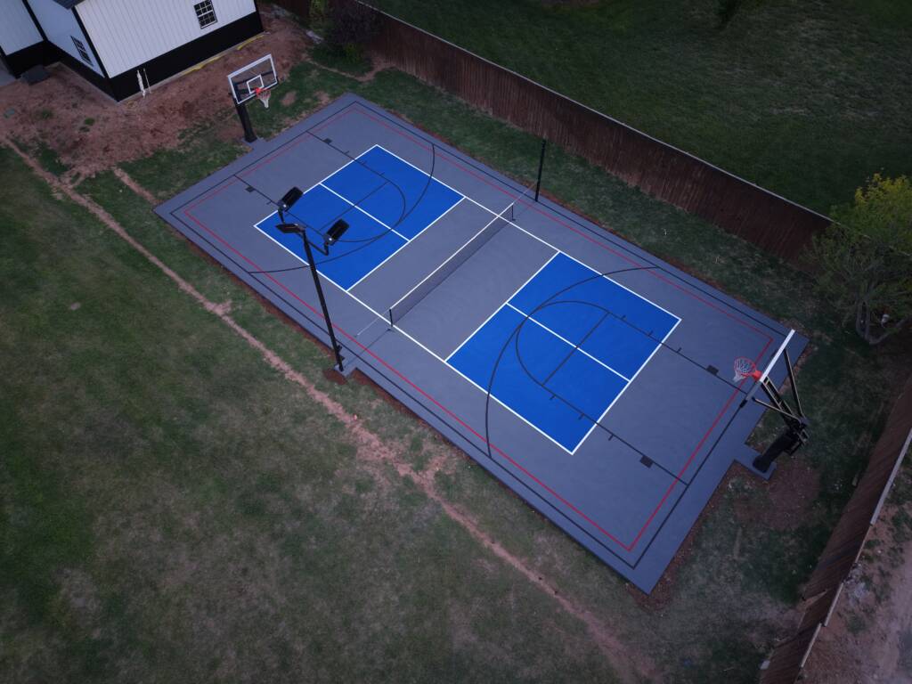 Backyard pickleball court with acrylic hard court surface and LED lighting in Lubbock, TX backyard multi-sport court West Texas