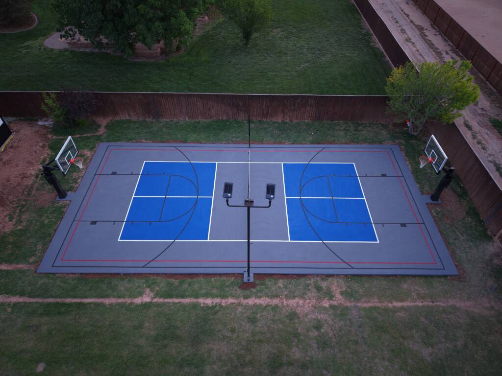 Backyard pickleball court with acrylic hard court surface and LED lighting in Lubbock, TX backyard multi-sport court West Texas