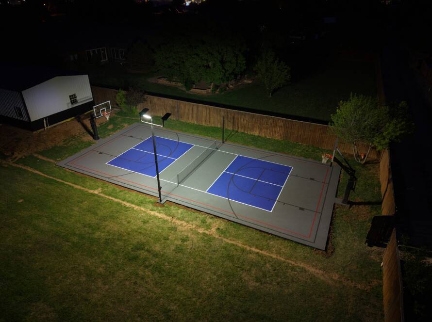 Backyard pickleball court with SnapSports surface and LED lighting in Lubbock, TX