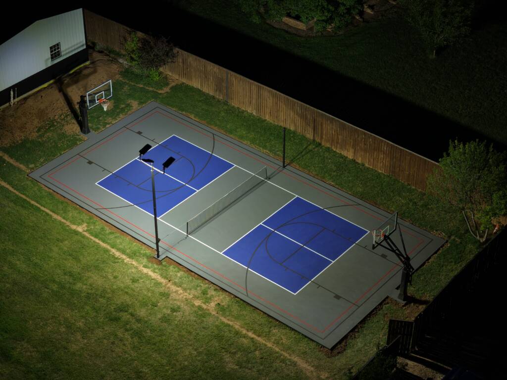 Backyard pickleball court with SnapSports surface and LED lighting in Lubbock, TX