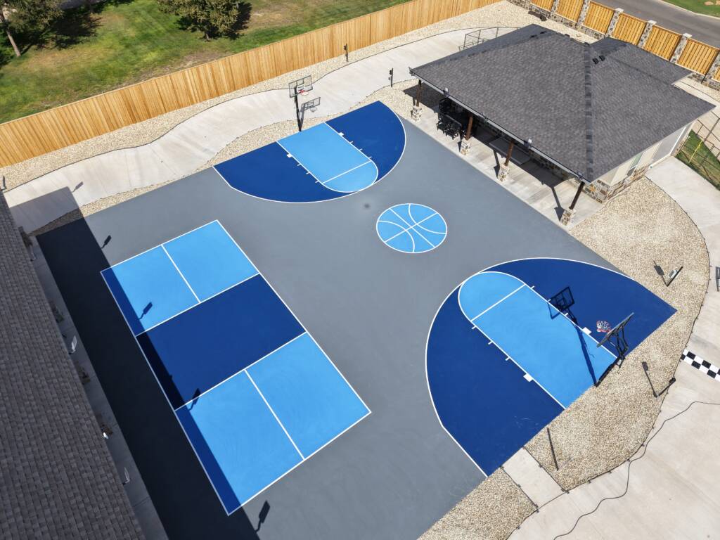 Backyard pickleball court with acrylic hard court surface and LED lighting with a race track in Lubbock, TX