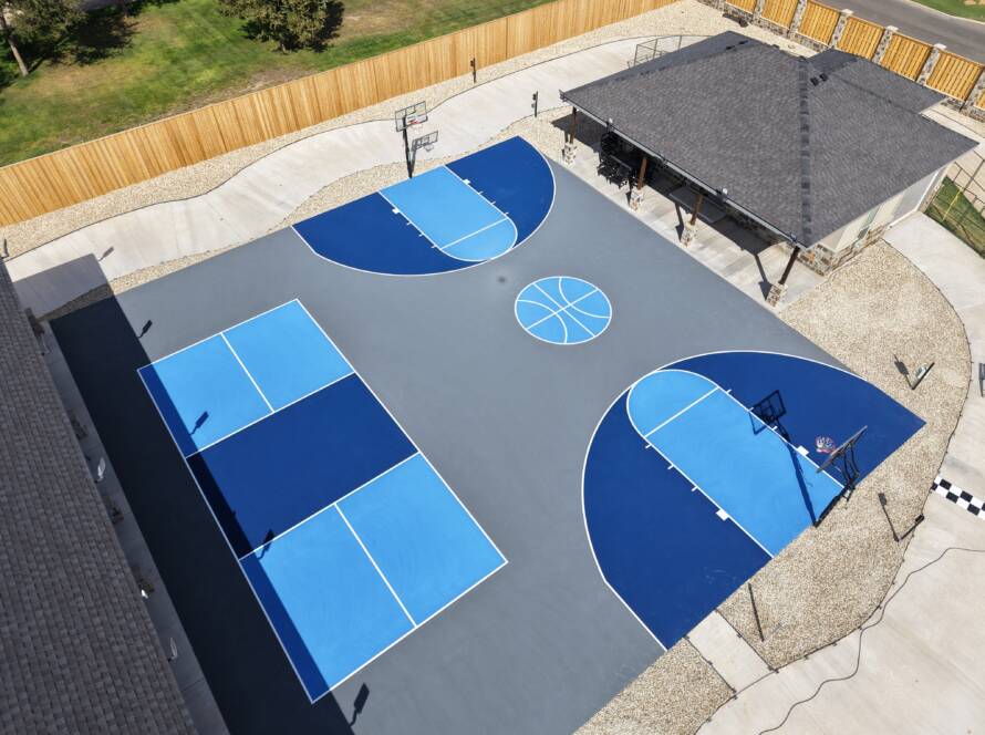 Backyard pickleball court with SnapSports surface and LED lighting with a race track in Lubbock, TX