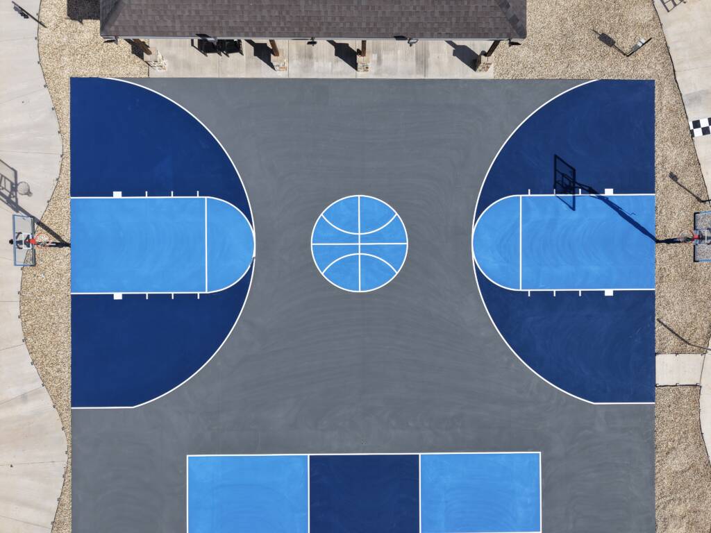 Backyard pickleball court with acrylic hard court surface and LED lighting with a race track in Lubbock, TX