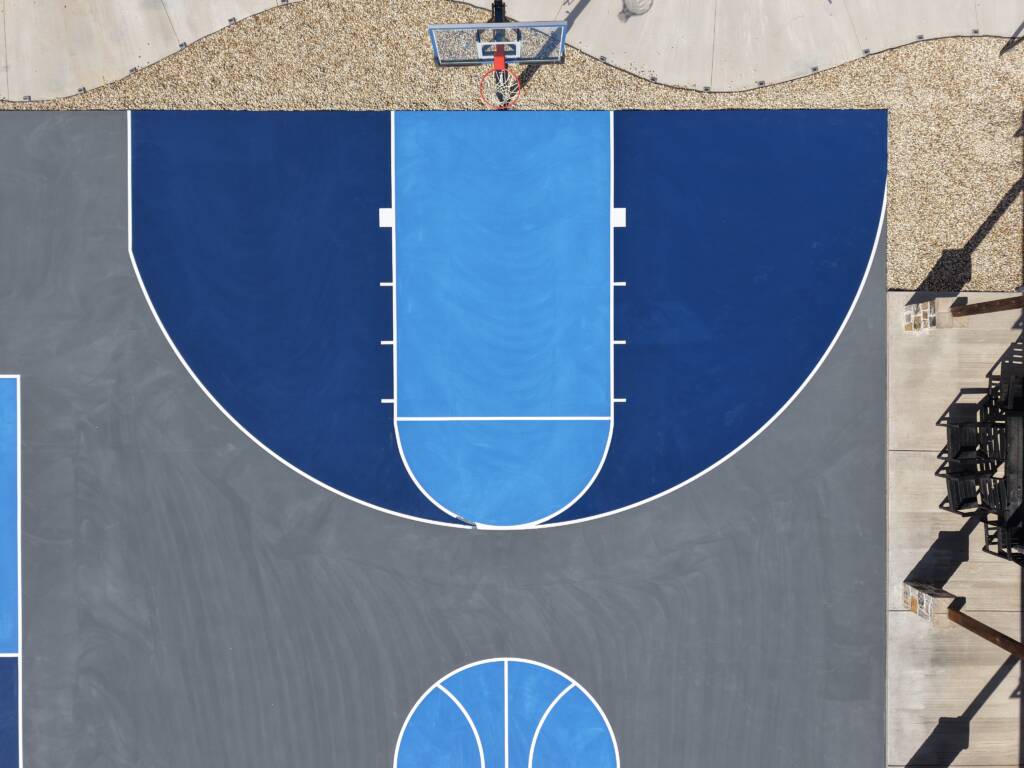 Backyard pickleball court with acrylic hard court surface and LED lighting with a race track in Lubbock, TX