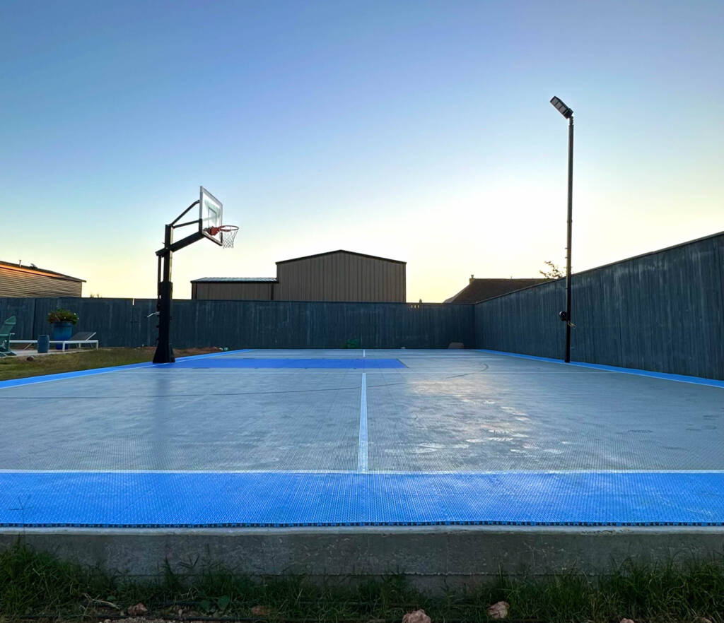 Backyard pickleball court with SnapSports surface and LED lighting in Lubbock, TX