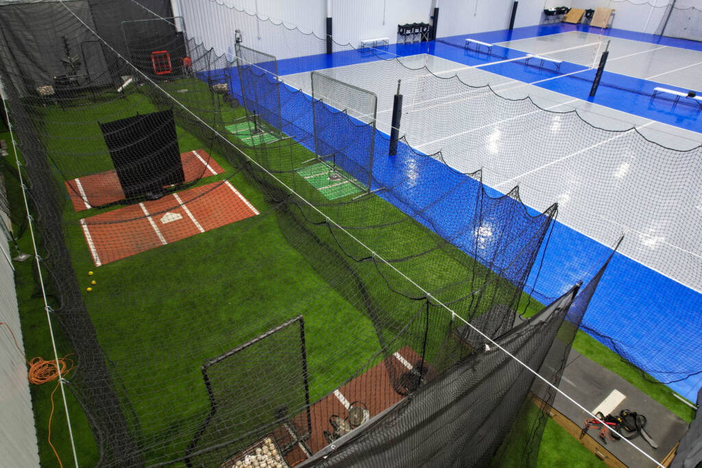 Indoor Multi-sport court with SnapSports modular tiles and turf batting cages in Lubbock, TX