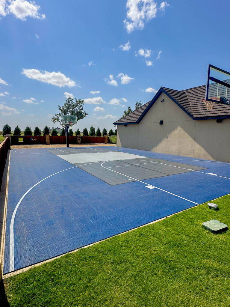Custom basketball and pickleball combo court in a Lubbock residential yard